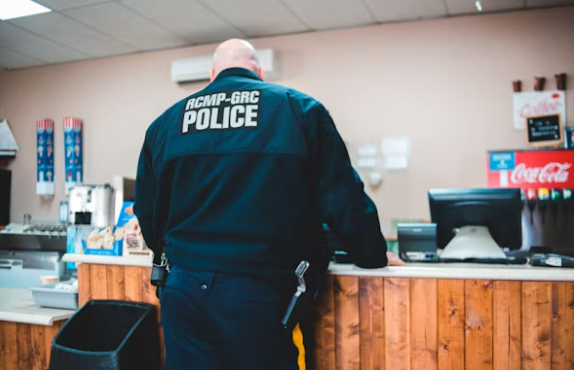 Police officer checking mobile phone